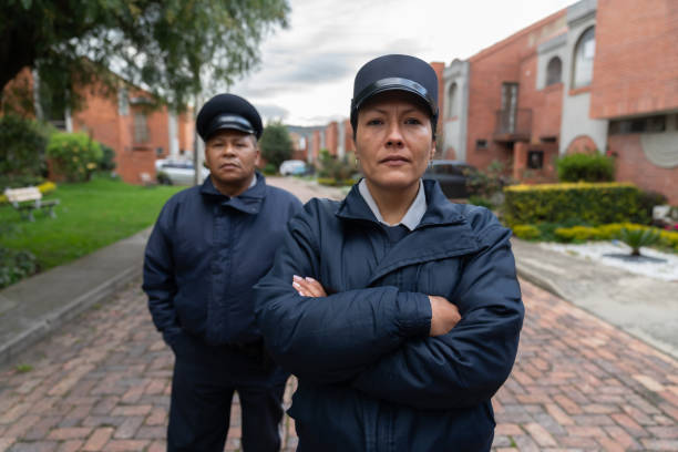 Team of strong of security guards working at a gated community looking very serious - safety concepts